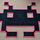 Illustration for article titled A Retro Rug That Only Battles Dirty Shoes, Not Invaders From Space